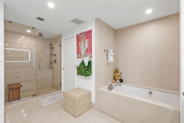 bathroom featuring shower with separate bathtub and tile patterned floors