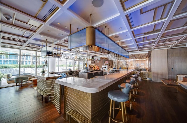 bar featuring coffered ceiling and dark hardwood / wood-style flooring