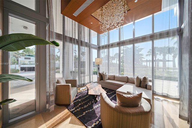 sunroom with a notable chandelier