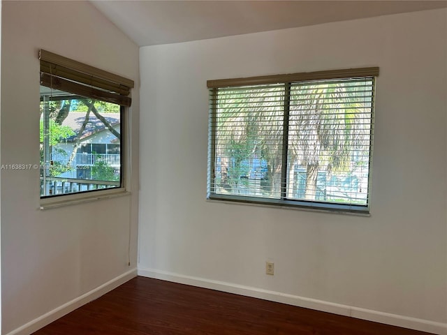 empty room featuring dark hardwood / wood-style flooring