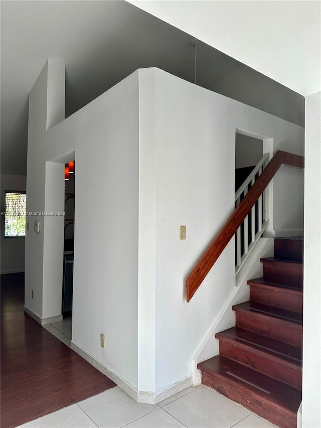 stairs with hardwood / wood-style floors