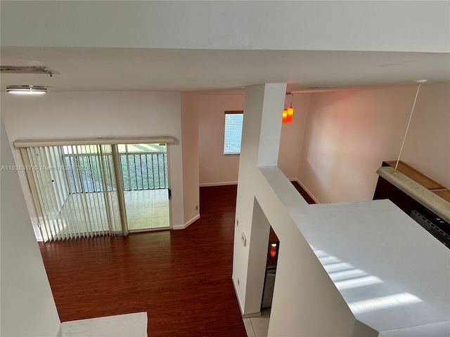 hallway with dark wood-type flooring