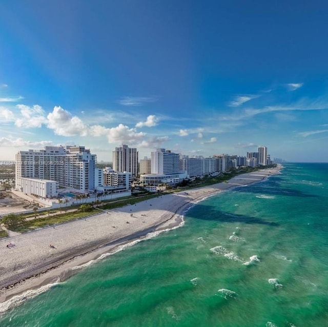 bird's eye view featuring a view of city, a water view, and a view of the beach