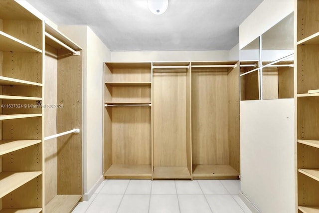 spacious closet featuring tile patterned floors