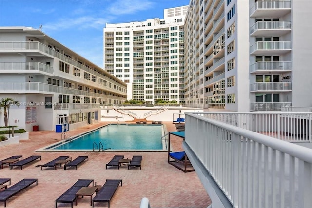 view of swimming pool with a patio area