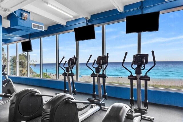 gym featuring a water view