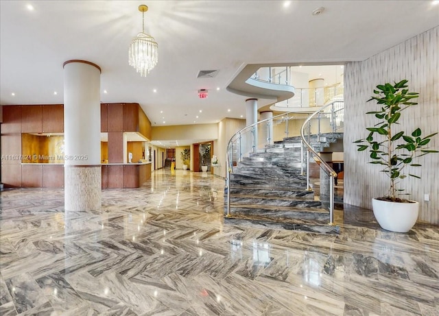 lobby featuring stairway and visible vents