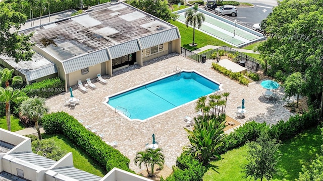 view of swimming pool with a patio