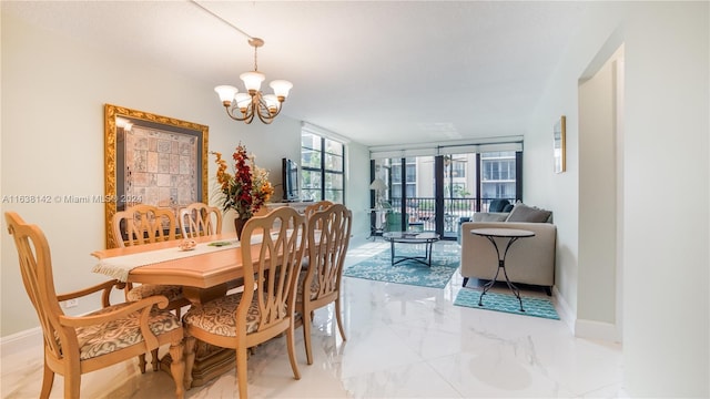 tiled dining space featuring a notable chandelier and expansive windows