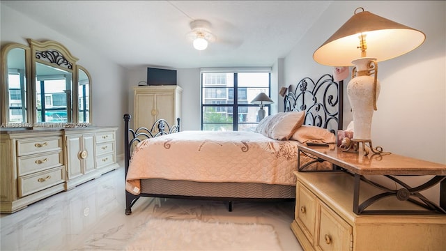 bedroom featuring ceiling fan and light tile patterned flooring