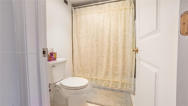 bathroom featuring toilet