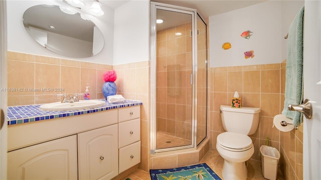 bathroom featuring tile walls, tile patterned floors, vanity, and decorative backsplash