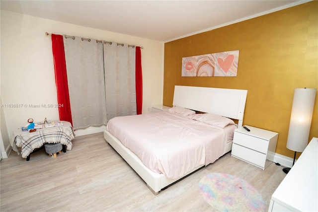 bedroom featuring light wood-type flooring