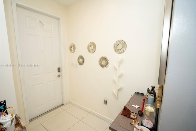 doorway featuring light tile patterned floors