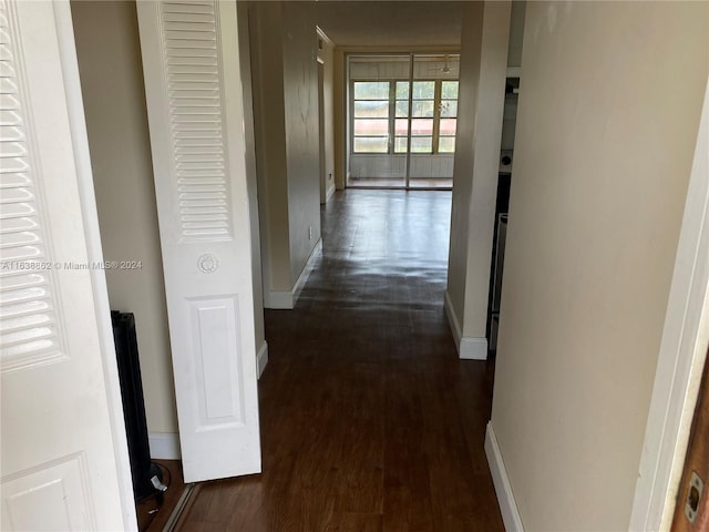 hallway featuring dark hardwood / wood-style floors