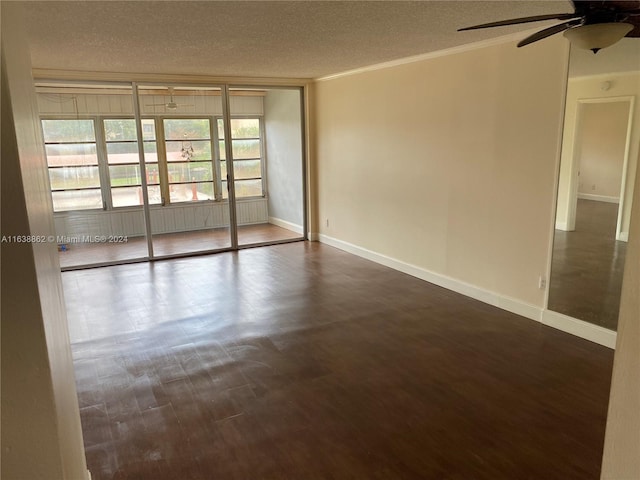 unfurnished room featuring a textured ceiling, plenty of natural light, and dark wood-type flooring