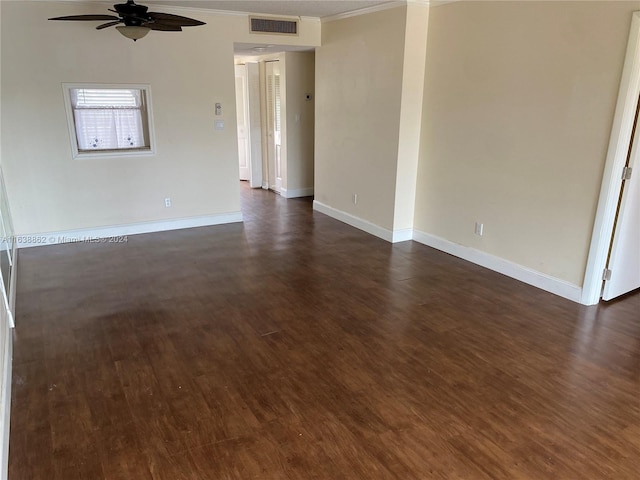 unfurnished room with ceiling fan, dark hardwood / wood-style flooring, and ornamental molding