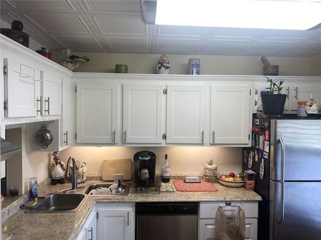 kitchen featuring white cabinetry, sink, and appliances with stainless steel finishes