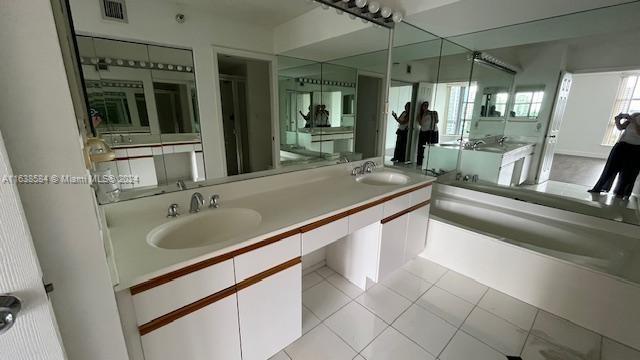 bathroom featuring a bathing tub and vanity