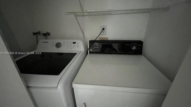 washroom featuring washer and dryer