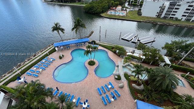 view of pool with a water view