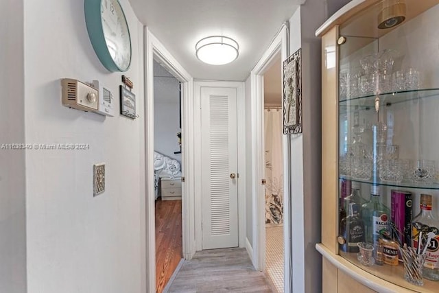 hallway featuring wood finished floors