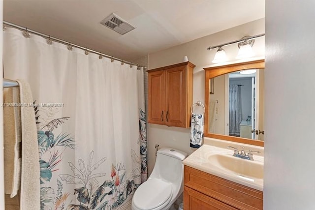 bathroom with a shower with shower curtain, visible vents, vanity, and toilet