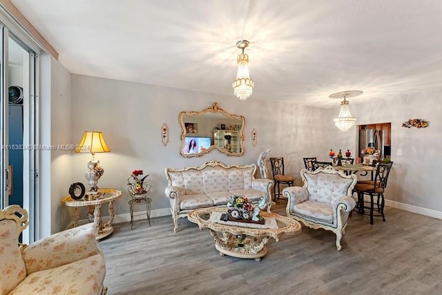 sitting room featuring baseboards and wood finished floors