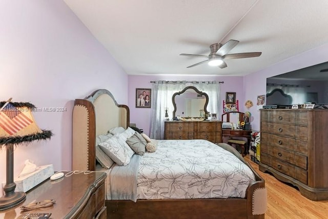 bedroom featuring ceiling fan and wood finished floors