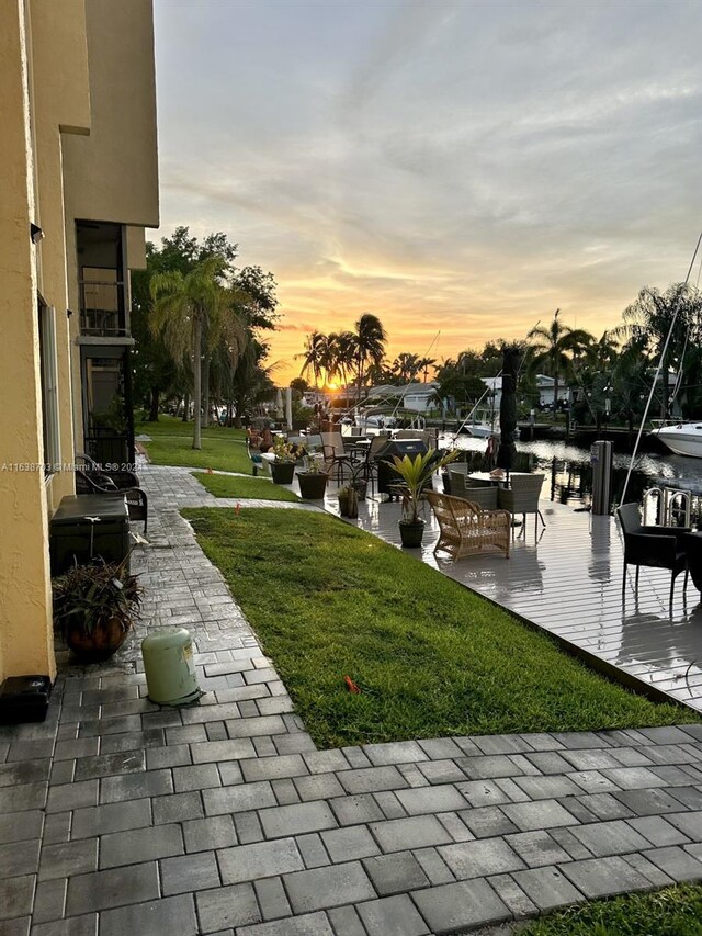 yard at dusk with a water view