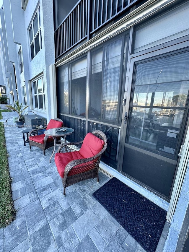 doorway to property featuring a patio area