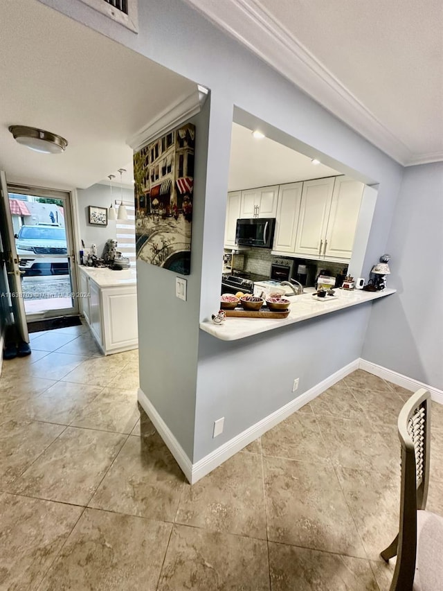 kitchen featuring pendant lighting, black appliances, kitchen peninsula, decorative backsplash, and white cabinetry