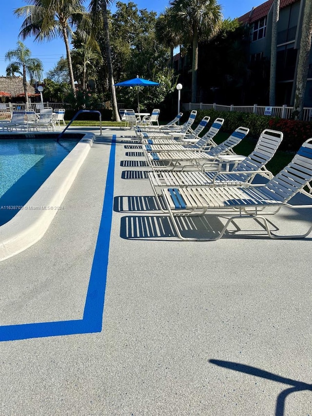 view of swimming pool with a patio area