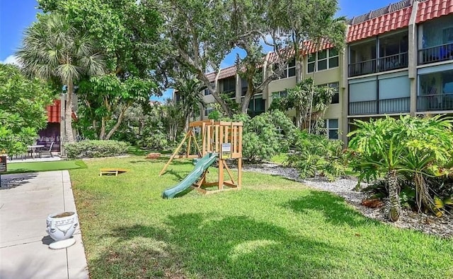 view of jungle gym with a lawn