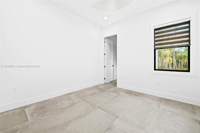 empty room with light tile patterned floors