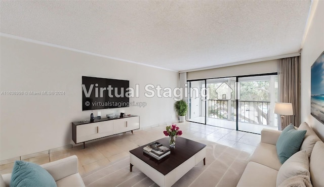 living room featuring ornamental molding, a textured ceiling, and light tile patterned floors