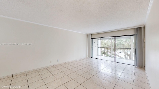 empty room with crown molding, a textured ceiling, and light tile patterned floors