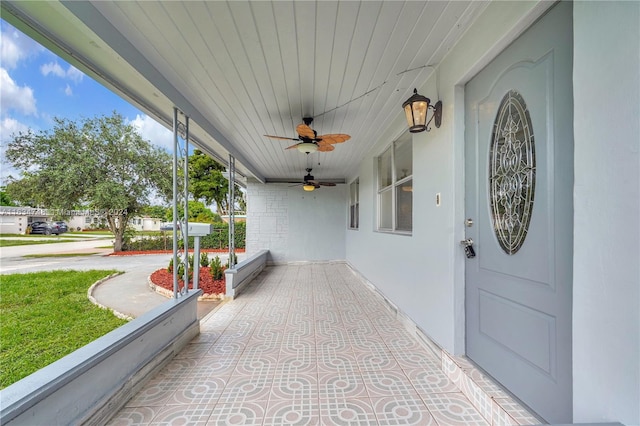 exterior space featuring covered porch and ceiling fan