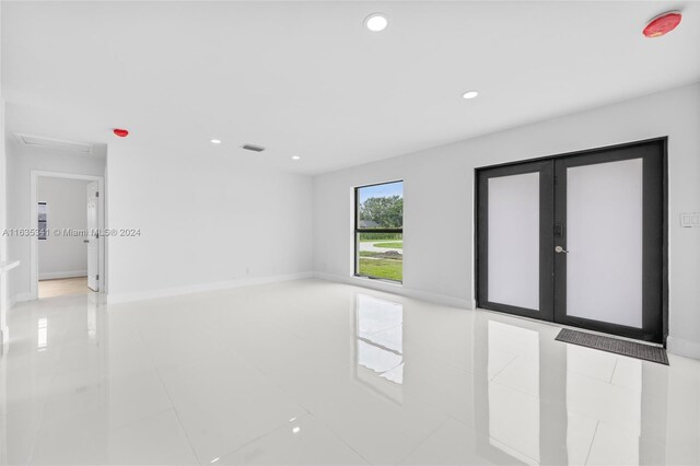 spare room featuring tile patterned flooring