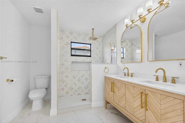 bathroom featuring vanity, toilet, and walk in shower