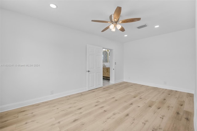 unfurnished room featuring ceiling fan and light wood-type flooring