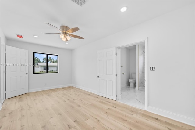 unfurnished room featuring light wood-type flooring and ceiling fan