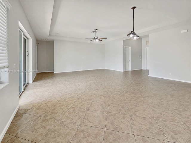 empty room featuring ceiling fan and light tile patterned flooring