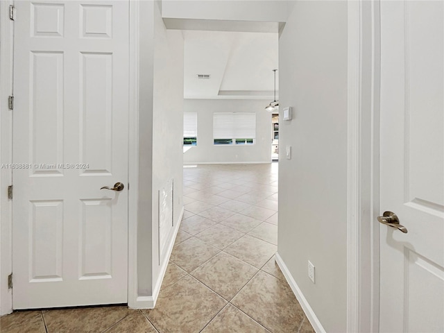 hall with light tile patterned flooring