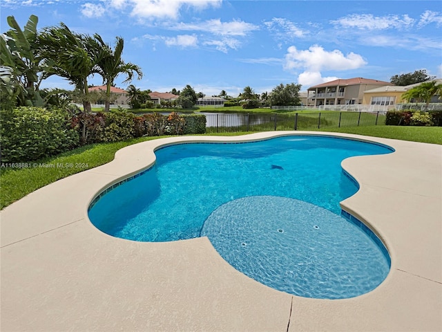 view of pool with a lawn