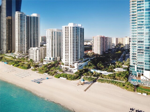 aerial view featuring a water view and a view of the beach