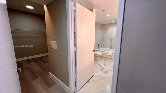 bathroom with shower / tub combination and toilet