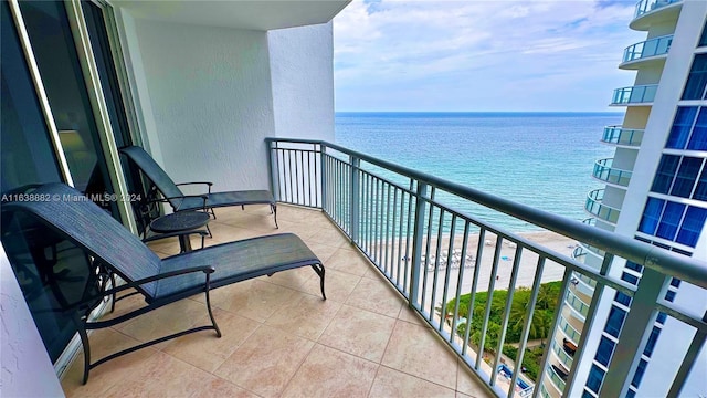 balcony featuring a water view