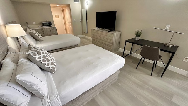 bedroom featuring light wood-type flooring