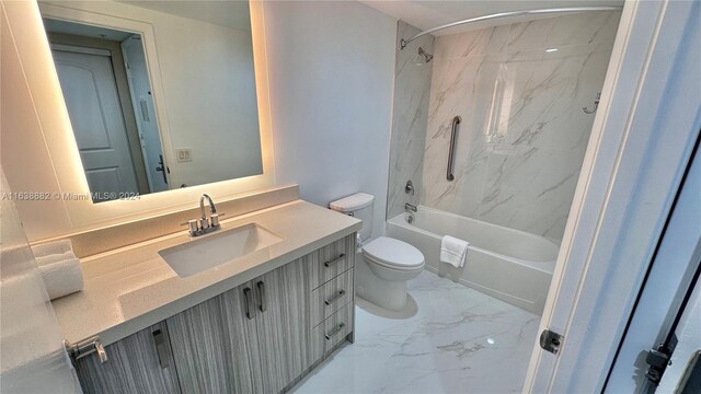 full bathroom with tiled shower / bath, vanity, and toilet